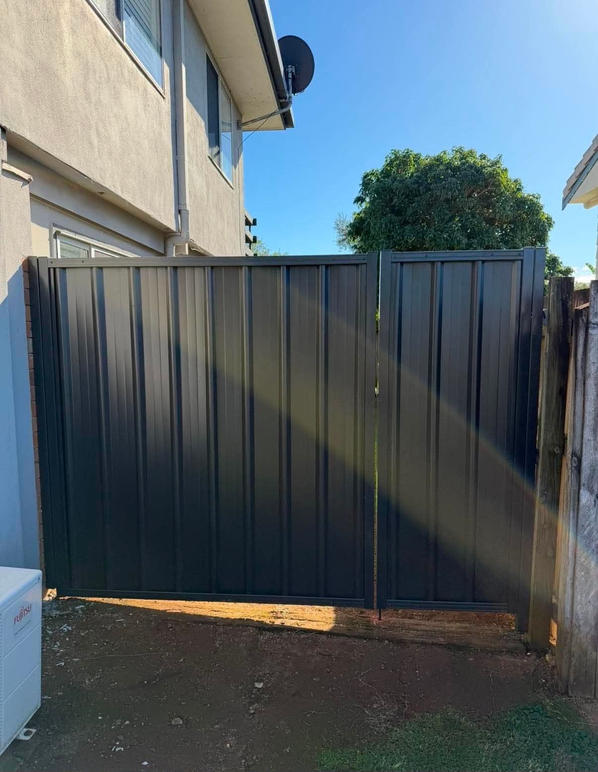 Close view of the completed Colorbond gate and fence line