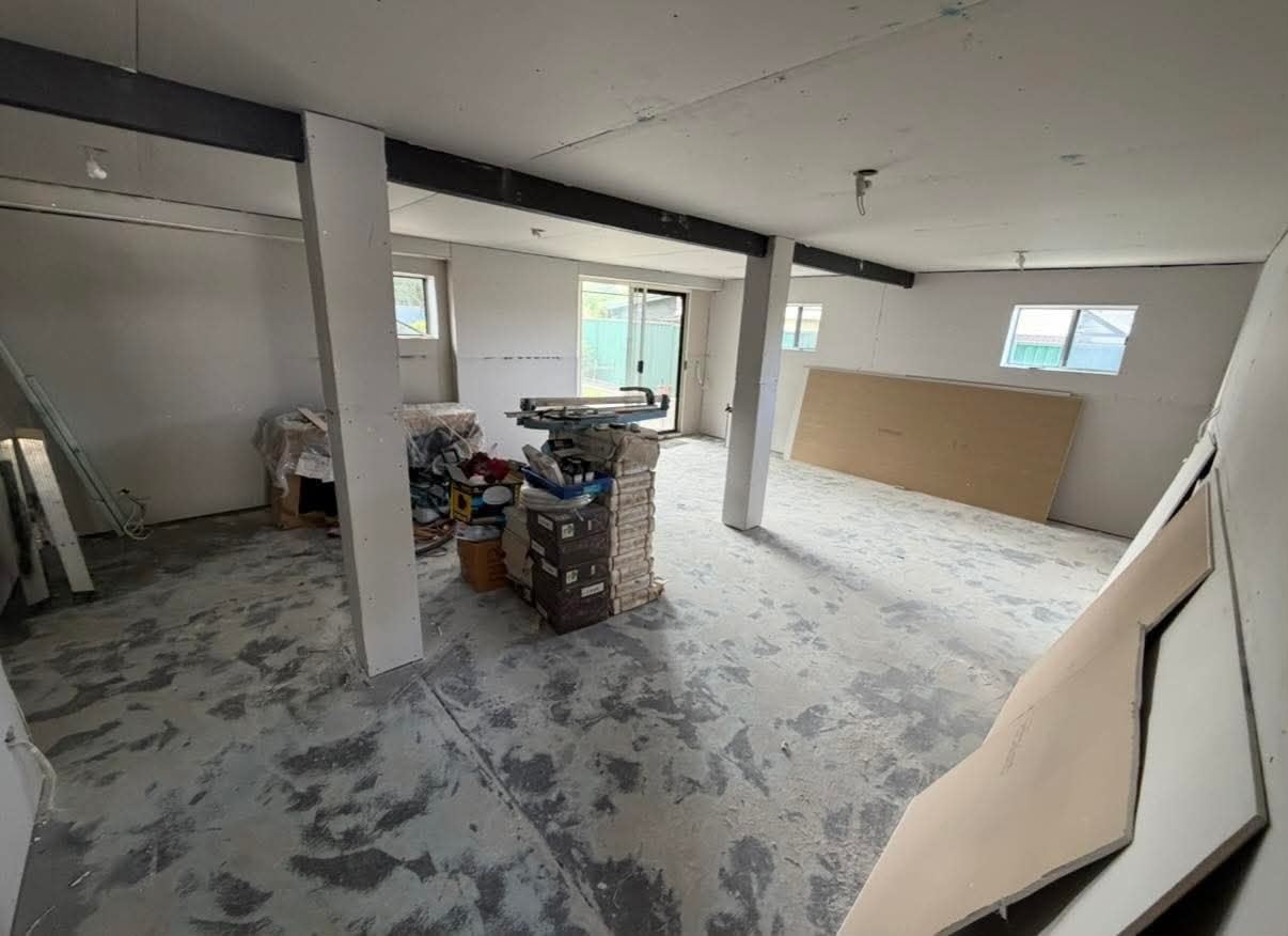 Open-plan ground-floor conversion with new walls and ceiling work in progress