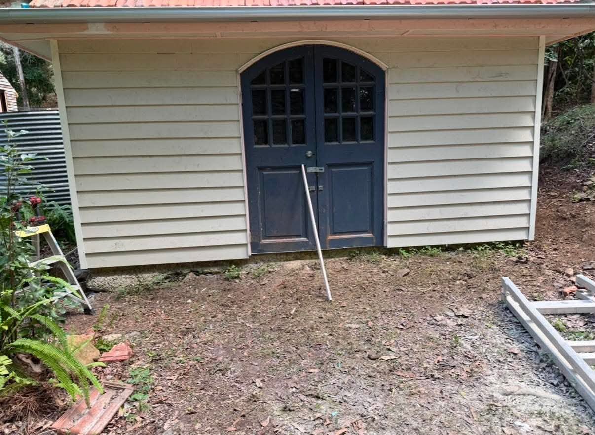 Garden shed front elevation before exterior carpentry repairs