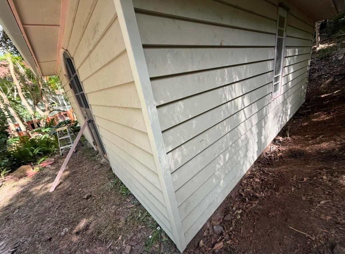 Close view of weathered shed cladding requiring replacement