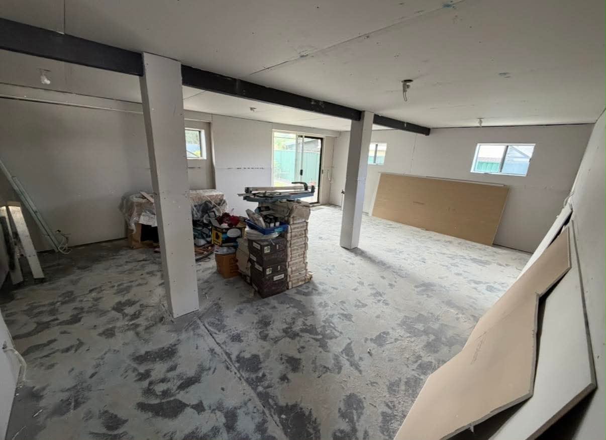 Ground floor interior conversion in progress with new walls, ceilings and tiled floor ready for fit off